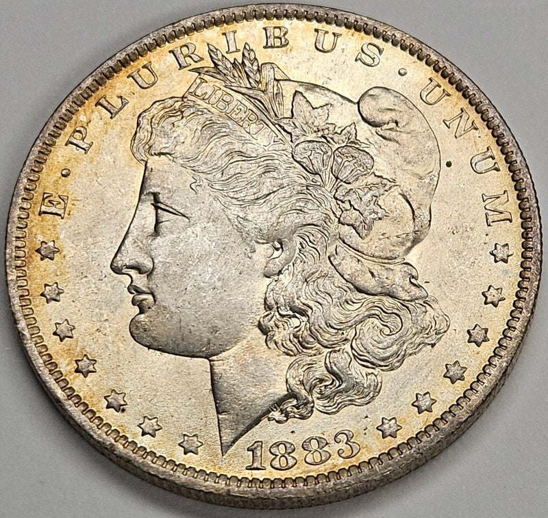 1883-O Morgan Dollar Choice BU Golden Toning