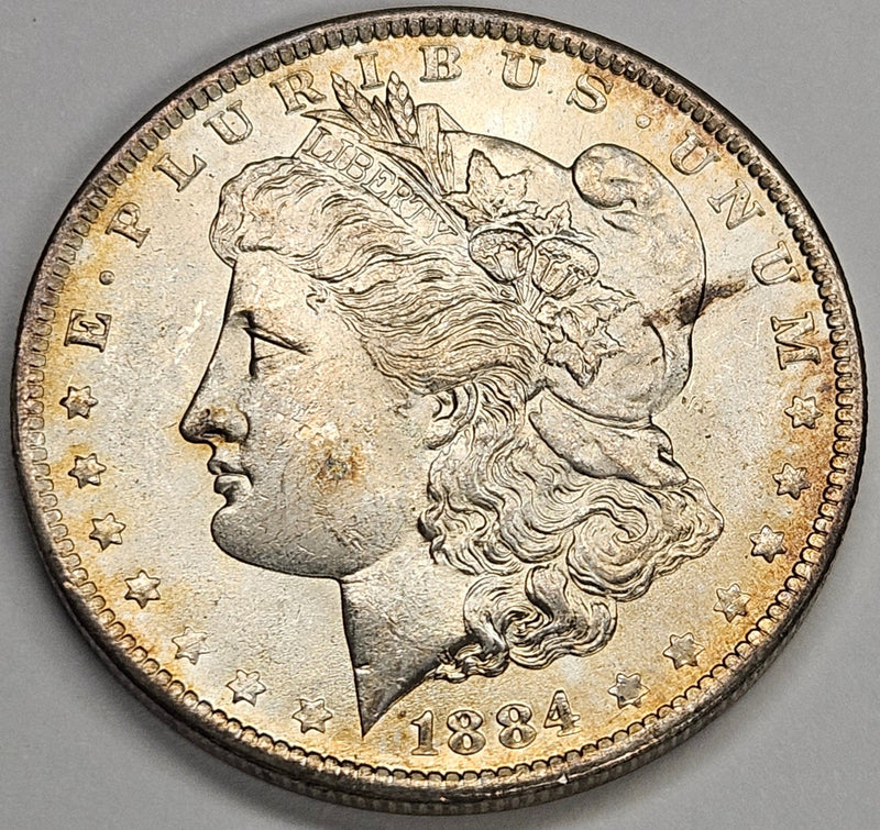 1884-O Morgan Dollar Choice BU Golden Toning