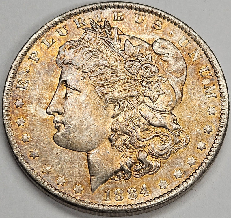 1884-O Morgan Dollar Choice BU Golden Obverse Toning