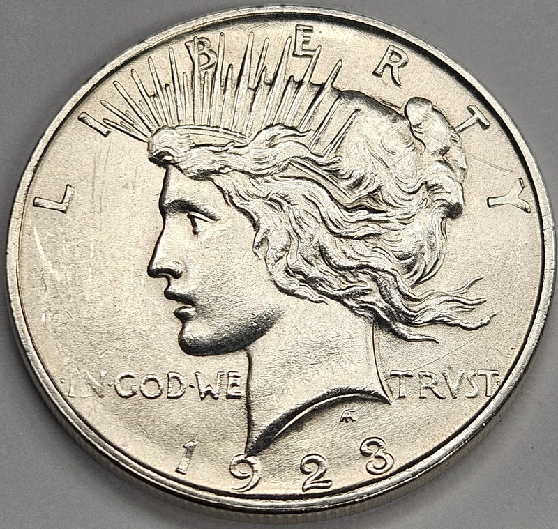 1923-D Peace Dollar . . . . BU harshly cleaned