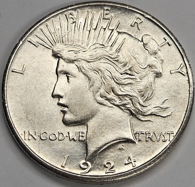 1924-S Peace Dollar . . . . AU lightly cleaned