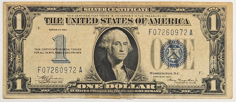$1.00 1934 Silver Certificate . . . . VF torn and taped