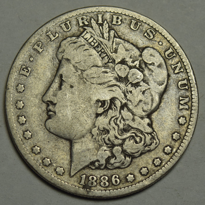 1886-O Morgan Dollar . . . . Fine